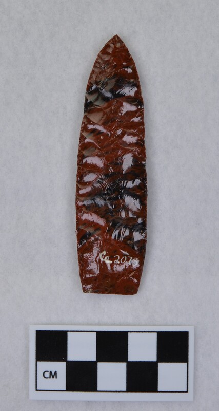 Collateral flaking, lanceolate style, basal margin lightly ground, base thinned