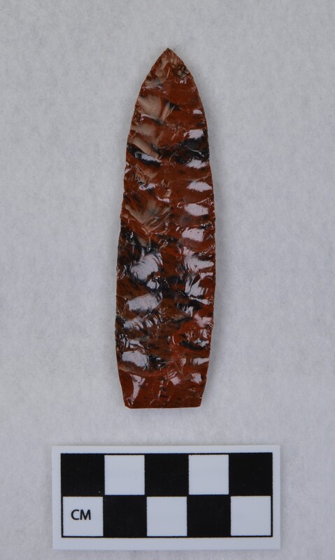 Collateral flaking, lanceolate style, basal margin lightly ground, base thinned