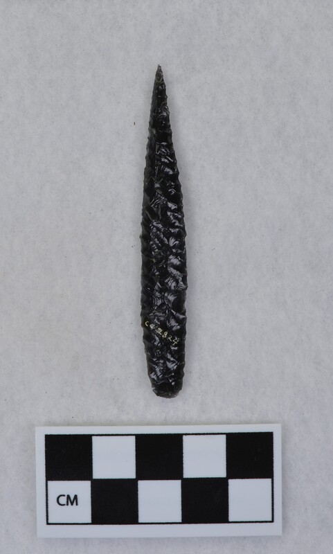 Parallel diagonal flaking to midsection, lanceolate style point, ground and thinned basal margins