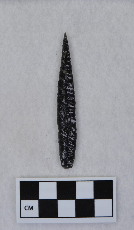 Parallel diagonal flaking to midsection, lanceolate style point, ground and thinned basal margins