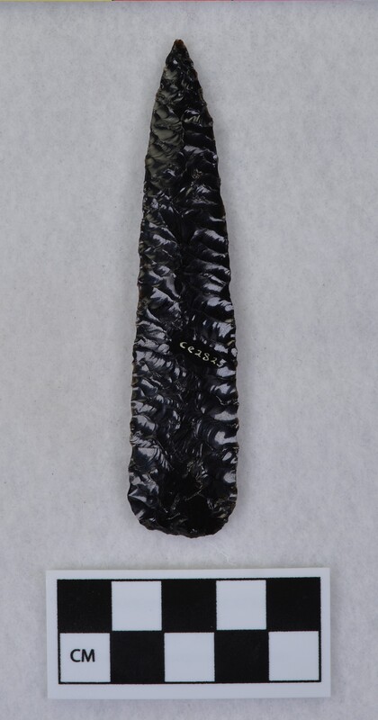 Parallel diagonal flaking to midsection, basal thinning and light grinding