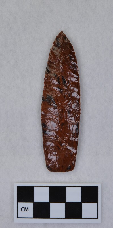 Parallel diagonal flaking, heavily ground basal margin, lanceolate style