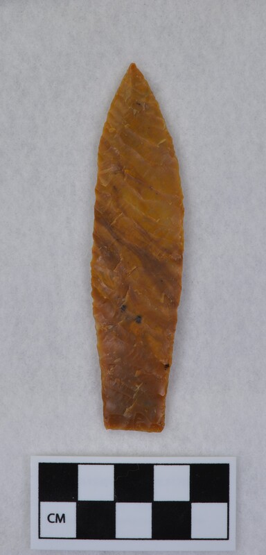 Heat treated, parallel oblique flaking, lanceolate style, ground and thinned basal margins