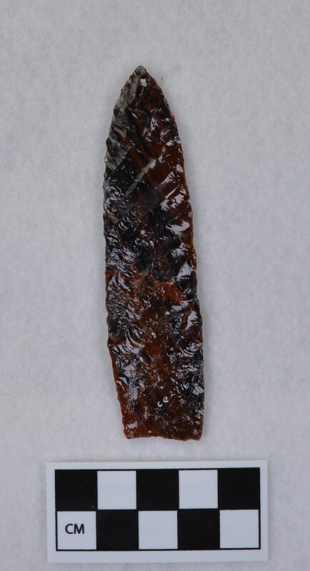 Parallel diagonal flaking one face, lanceolate style, edges slightly ground