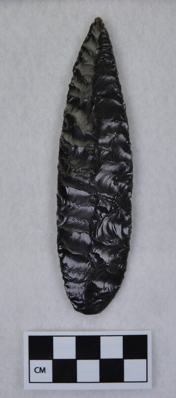 Flaked to midsection to form dorsal ridge, lanceolate style point, ground and thinned basal margins