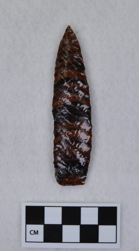 Lanceolate style point. Flakes run full length of face. (JW) Signed by Crabtree.