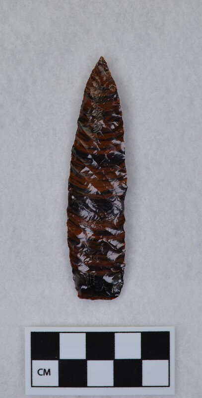 Lanceolate style point. Flakes run full length of face. (JW) Signed by Crabtree.