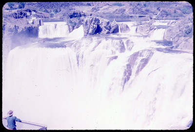 A photographic slide of a scenic view of a series of waterfalls.
