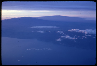 A photographic slide of an aerial view of a lake and surrounding hills.