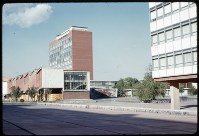 A photographic slide of an urban campus with geometric buildings.