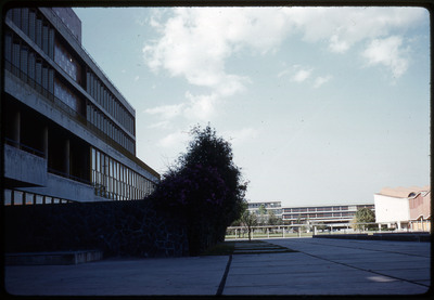 A photographic slide of an urban campus with geometric buildings.