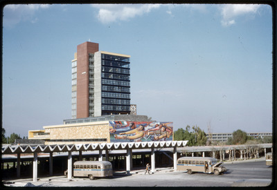 A photographic slide of an urban campus with geometric buildings.