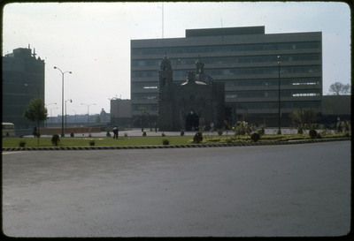 A photographic slide of a historical church in the midst of an urban area.