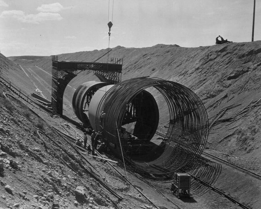 Winton-Utah Contract on West Canal under Specs. 1286. This view, looking east, shows (right to left) reinforcing steel being placed for Dry Coulee Siphon No. 1, the two invert forms, which fit inside the steel for placing concrete, and the outside shell for the concrete-placing cycle.