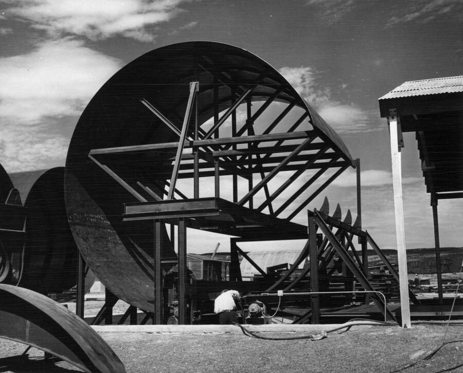 Columbia Basin Project, Irrigation Division, Soap Lake Siphon, Specifications No. 2411--Utah Construction Co. and Winston Bros., Contractor. This photograph shows a "liner plate" about three quarters rolled. H.E. Foss, photographer