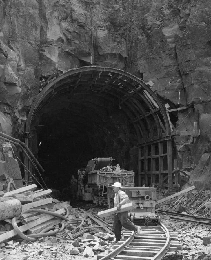 Columbia Basin Project, Irrigation Division I. Bacon Tunnel, Specifications 1236, T.E. Conolly Inc., Contractor. Inlet portal of the Bacon Tunnel showing the full size of tunnel and steel supports in position