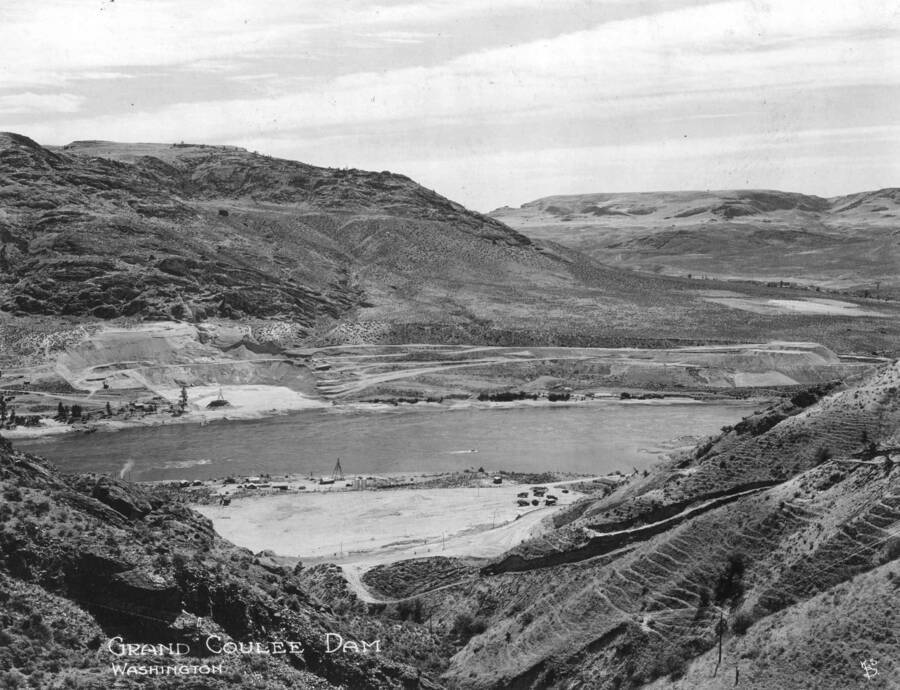 Distance view of the future site of Grand Coulee Dam. Excavation operations may be seen in foreground.