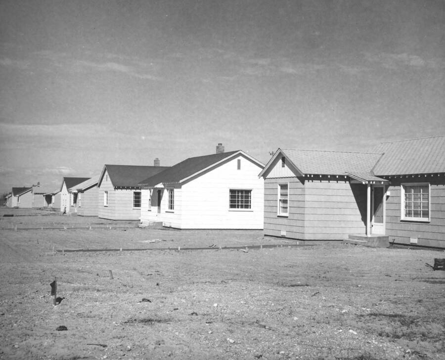 Columbia Basin Project, Irrigation Division. Othello Government Housing, Specifications No. R1-CB-30. View looking west along county road continuous with Main Street of Othello, Wash., Showing three three-bedroom and seven two-bedroom permanent type residences.