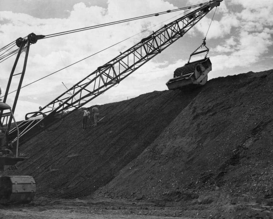 Columbia Basin project, Irrigation division, Main Canal, Specifications No. 2324, Western Contracting Corporation contractors. Rolling compacted cushion on 1st slope of main canal densities have been obtained with from six to eight passes on a 4 inch thick lift. Harold Foss, photographer.