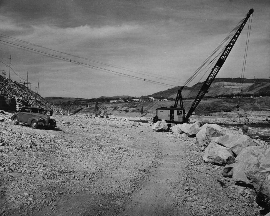 Showing granite armor rock along the left riverbank below Grand Coulee Dam ready for placing in section 'A.' The rock is obtained from the upriver quarry. This work is performed by J.A. Terteling and Sons, Inc., under provisions of negotiated contract I2r-18456, Specifications 2636