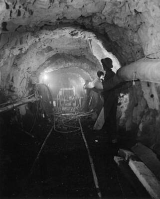 Columbia Basin Project, Irrigation Division, Long Lake Dam. Spec. #1401--J.A. Terteling and Sons, Contractor. Outlet works tunnel taken from outlet portal. Long lake Dam is two miles northeast of Stratford, Wash. A.W. Bauman, photographer