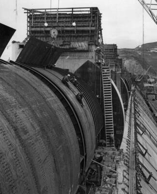 Men work on drum gate number one