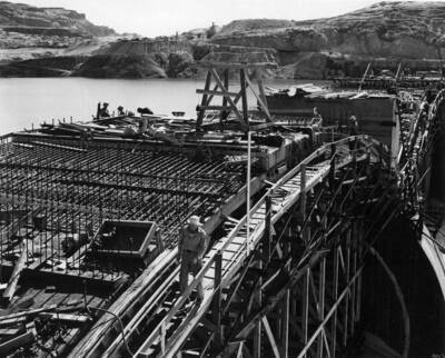 Close up view of men working on eastern spillway arch.