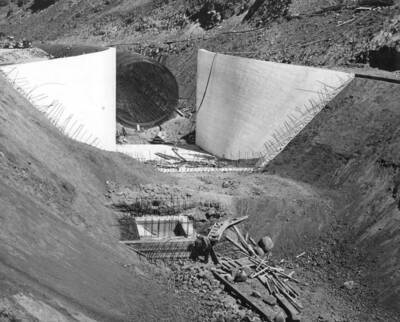 Columbia Basin Project, Irrigation Division, Soap Lake Siphon, Specifications 2411. This photograph shows the sump of the gravel trap and the partially constructed open inlet transition. The gap between the concrete and the circular re-steel is the location of the closed inlet transition. Work is performed by Winston Utah under Schedule I of the above specifications. H. E. Foss, photographer.