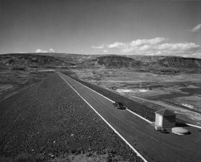 Columbia Basin Project, Irrigation Division, Specifications No. 1401, Long Lake Dam, Contractor: J.A. Terteling and Sons, Inc. A view of the completed dam from the east abutment. Long Lake Dam is 2 miles northeast of Stratford, Wa. Harold Foss, photographer.