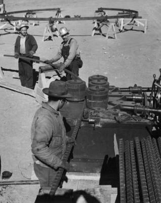 Columbia Basin Project, Irrigation Division, West Canal. Spec. #1286--Utah Construction Co. and Winston Bros. Co. contractor. Bending reinforcing bars for Dry Coulee
