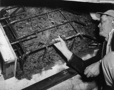 Columbia Basin Project, Irrigation Division, 3rd Section East Low Canal, Specs. 2879. Defective concrete removed on pin bearings, Weber Wasteway Turnout Sta. 1951+00, East Low Canal. Anchor bolts welded to re-steel for additional strength. Work is being performed by Western Contracting Corporation under Schedule #2 of above Specifications. H.E. Foss, photographer.