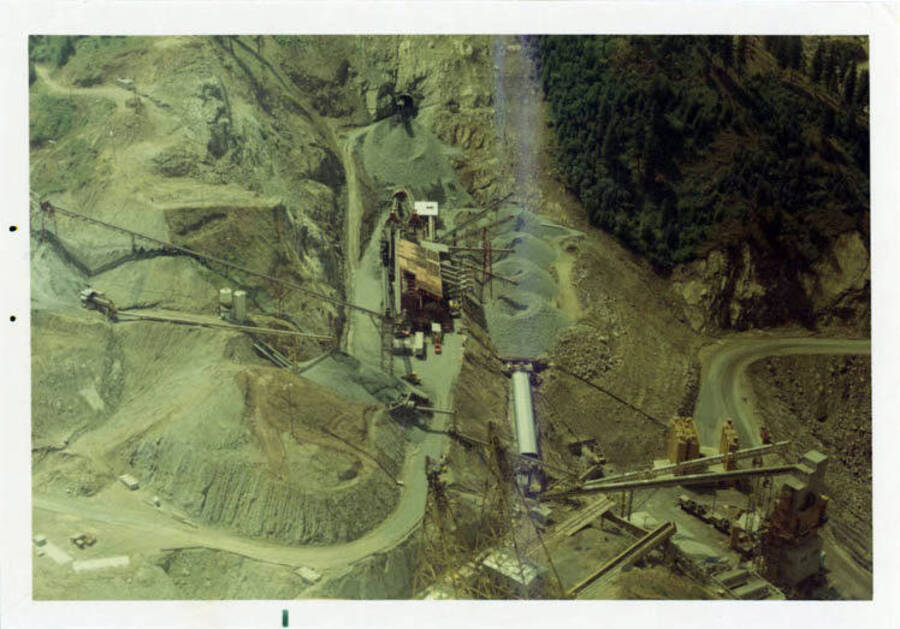 Photograph looking straight down on the job.  Showing the batch plant, crushed rock & tops of the cable towers.
