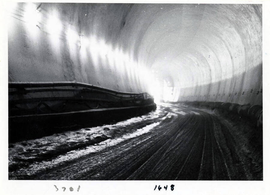 Photograph of interior of the diversion tunnel, which is 40' in diameter.  You can see the airlines and exhaust facilities.