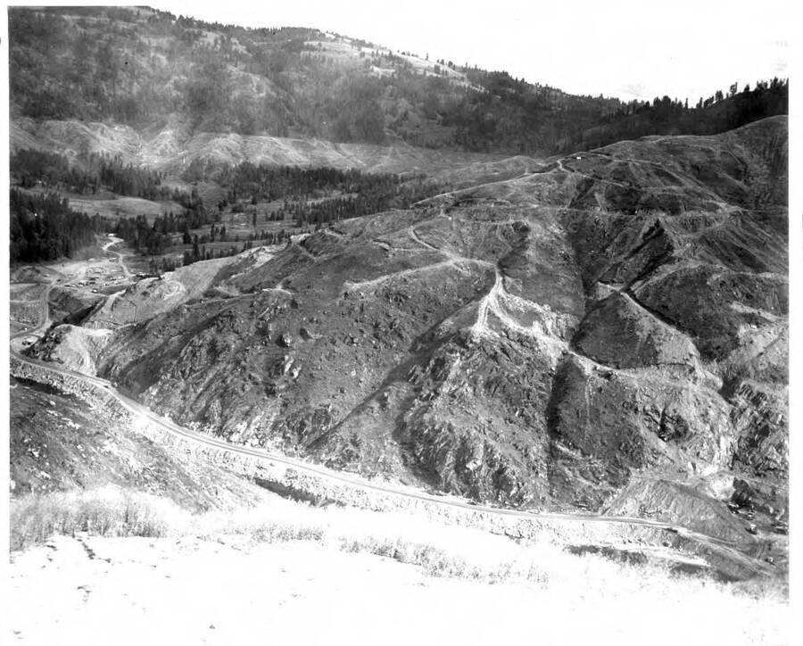 This shows a new road the Army built up the North Fork from Ahsahka so as to get to the base of the construction. Note on back: ""There was a county road on the opposite bank from this. This road was built on the south bank. Note here the land clearing has started at elevation 1605 above sea level.""