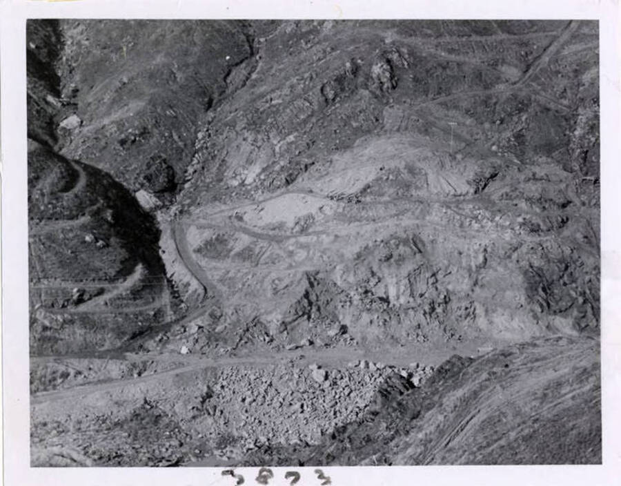 Photograph of blasting out material at dam site.