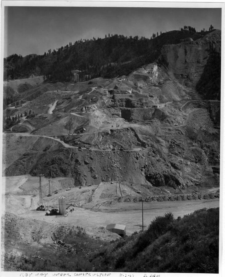Key way. You can see it coming down the mtn. Also, the Coffer dam under construction. This finally became 110 ft. high.  Note on image: ""Key Way under construction 8-3-67 D. Dam