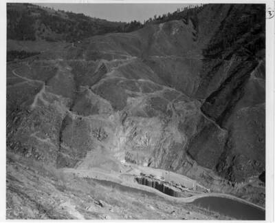 Steel piling about the mouth of the lower end of diversion tunnel. Also a start of site preparation.