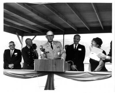 Ground-breaking ceremony Col. McElwee at speakers podium. Also shown are Wm. DreVlow, Pete Hyzer, Len Jordan, & Mrs. Henry Dworshak.