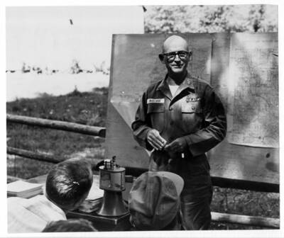 Col. McElwee of the Army Corps of Engineers, Walla Walla District. Note on back: ""Col. McElwee was on the program before Resource managers, explaining the project. He was a fine Col. and a very smart one. He was great but took a beating when he wanted to not replace the railroad from Lewiston down the Snake River to the Snake River dams. In this instance I (Curtis) had to take the other side and work for the re-location of the railroad down-stream from Lewiston. I think he got his orders from high-up, however, and readily agreed when things turned against him. He is now is New York with. Con. Ed. and has a great job with lots of responsibility. (A.B. Curtis - 1976)""