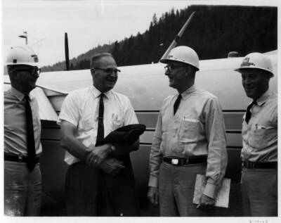 Mr. Curtis & three Army men visit the project on Aug. 19