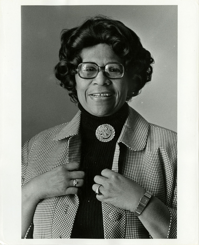 Black and white photograph of Ella Fitzgerald wearing a turtleneck and jacket