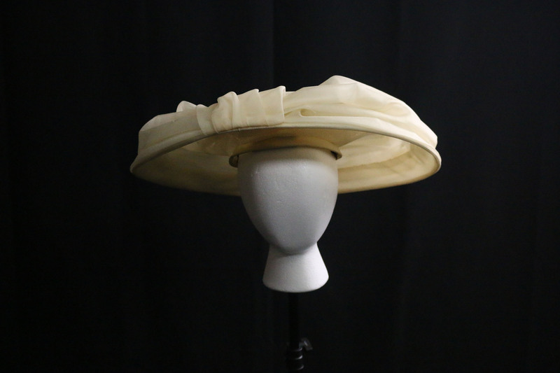 Cream wide brimmed organza hat. 
