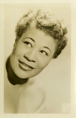 Postscard containing black and white photographed portait of Ella Fitzgerald.