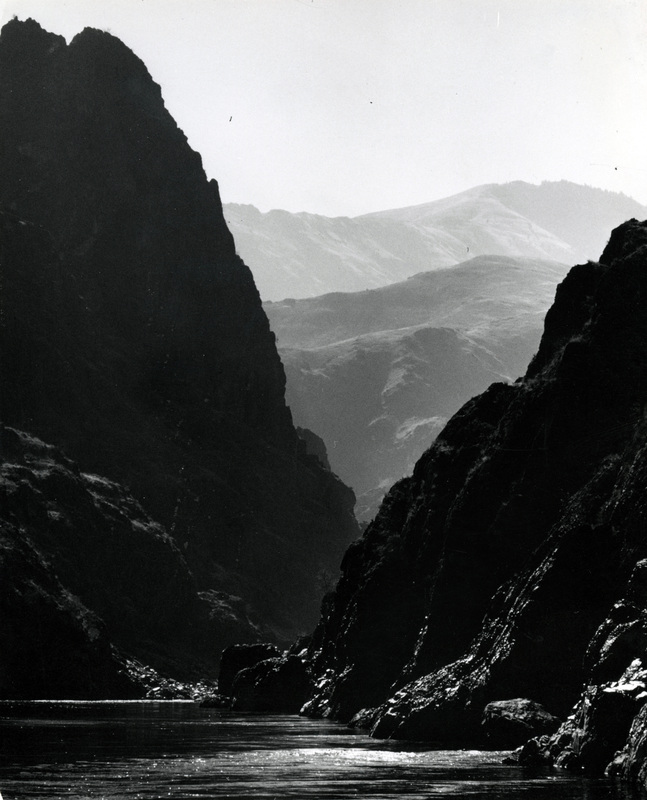 The Snake River flowing between the tall cliffs of Hells Canyon. 
