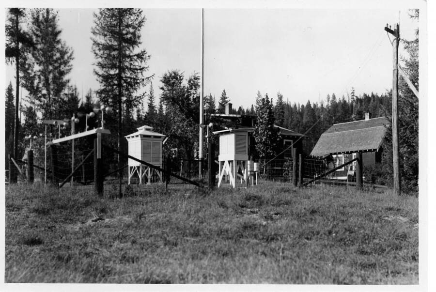 No date, large Hazen instrument shelter on left was installed in 1932, note anemometers mounted on fence for calibration.