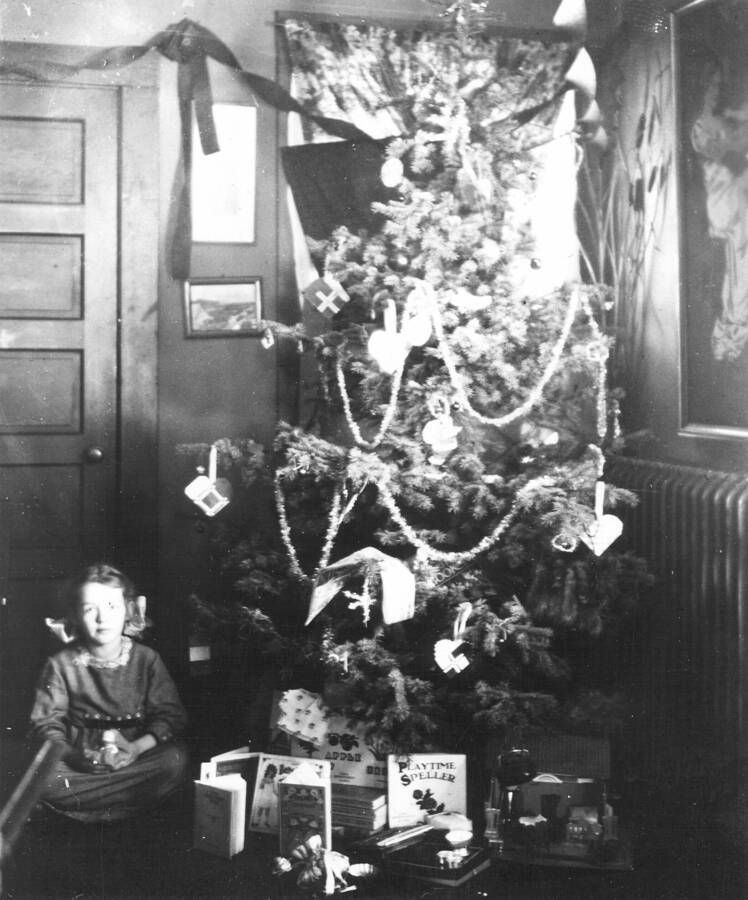 Left is daughter Margaret in front of a Christmas tree. The Larsens lived at Priest Creek Experimental Forest from 1913 to 1922.