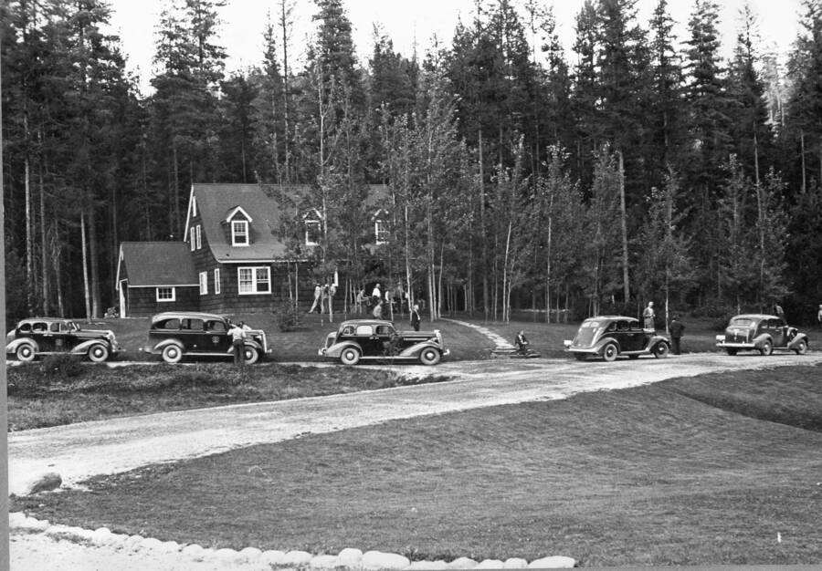 Cars in front of lodge, shortly after construction, judging by driveway arrangement, ca 1937.