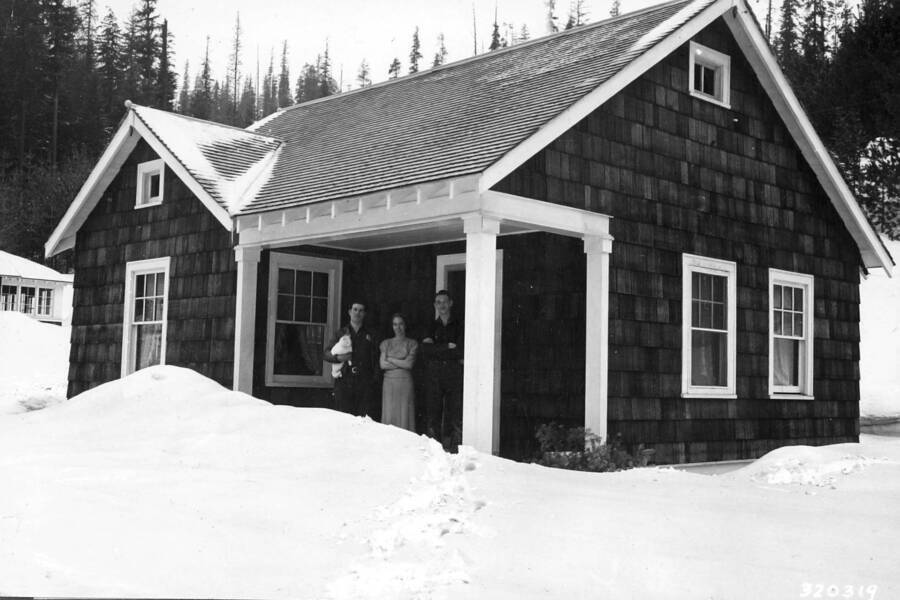 Cottage 2 Deception Creek, Galbraiths and Lloyd Hayes standing on porch. 3-36. By C.L. James.
