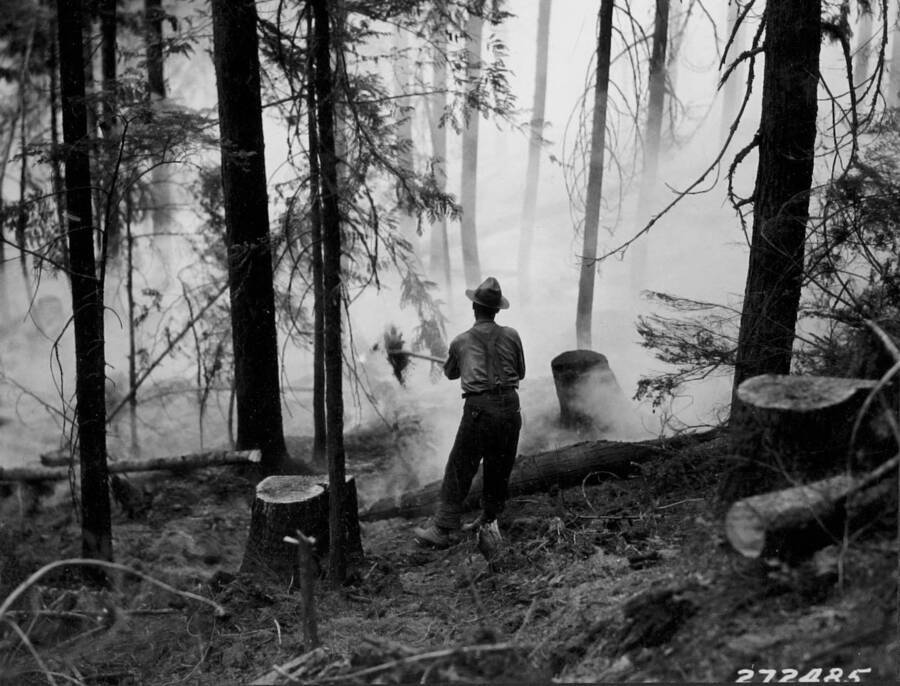 Quenching the flames with dirt at the Elmira fire.
