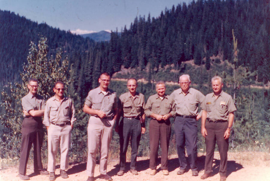 From the 1961/62 Report by Deitschman. Caption reads: "GFI inspection, Deception Creek Experimental Forest, July 22-24, 1962.  From left to right - Glenn Deitschman, Ray Boyd, Al Stage, Ostrom, Chuck Wellner, Liming, Pechanec."